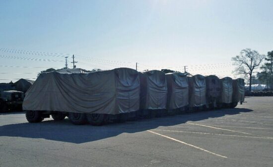 Trucks covered for outdoor storage