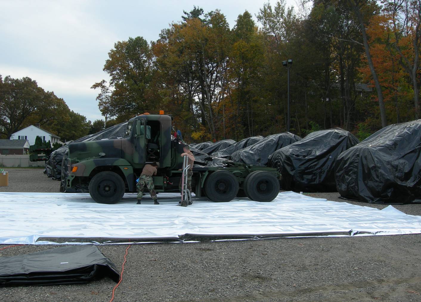 ARNG Trucks Being Packaged for Long-Term  Outdoor Storage